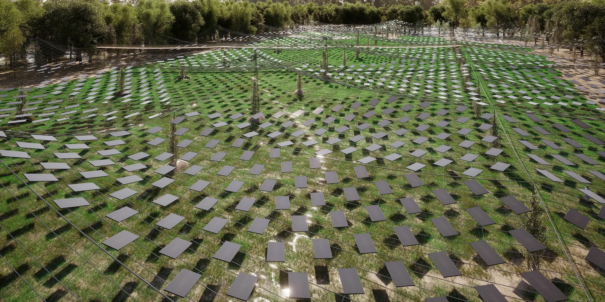 Deutsch: Luftperspektive der A-GRID Agrivoltaiks-Anlage mit PV-Modulen über weitläufigen grünen Agrarflächen. English: Aerial view of the A-GRID agrivoltaics installation with PV modules above expansive green agricultural fields.